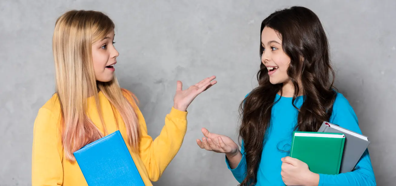 featured image of two kids using simple present tense