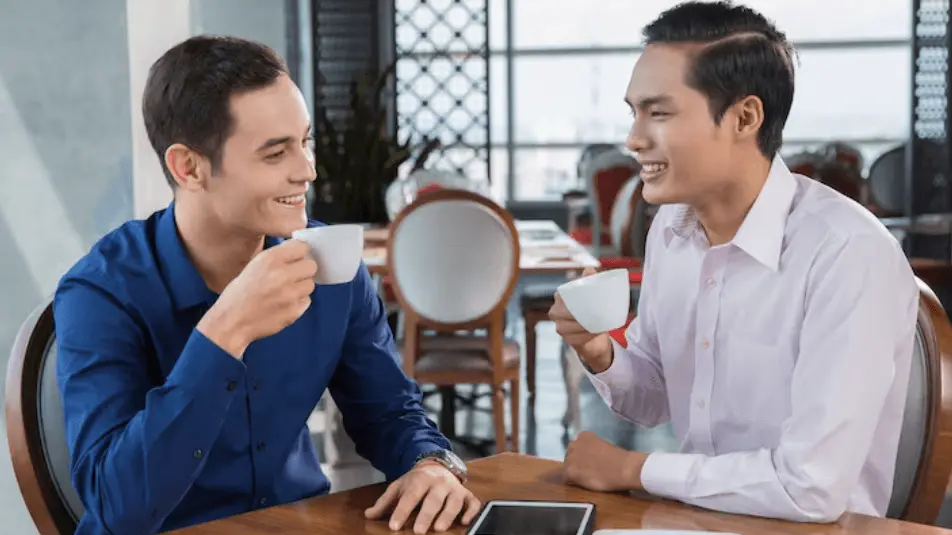 image of two men making a conversation in english